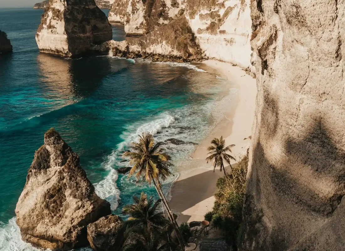 Towering Limestone Cliffs Dramatic karst formations rising straight out of turquoise water.